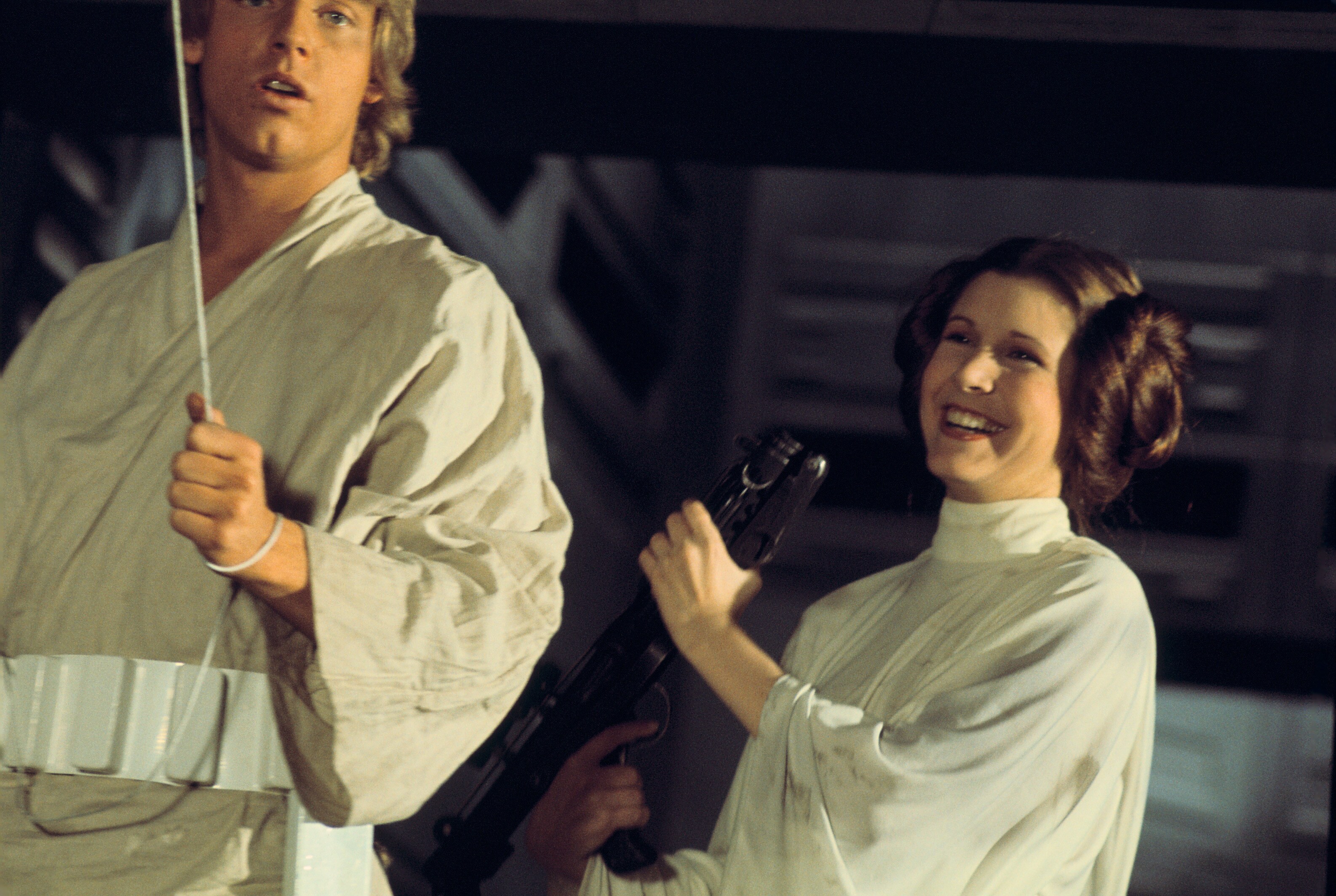 Mark Hamill and Carrie Fisher between takes of the "for luck" swing sequence.
