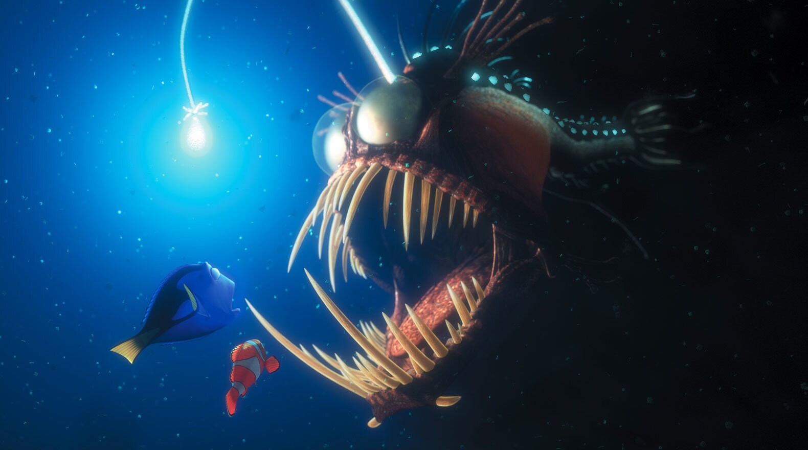 Albert Brooks as Marlin and Ellen DeGeneres as Dory, encounter a scary deep sea creature with light in "Finding Nemo"