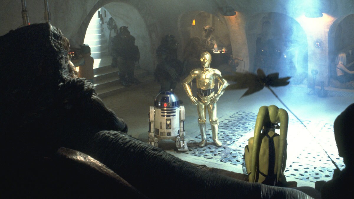 R2-D2 and C-3PO addressing Jabba the Hutt in his Palace