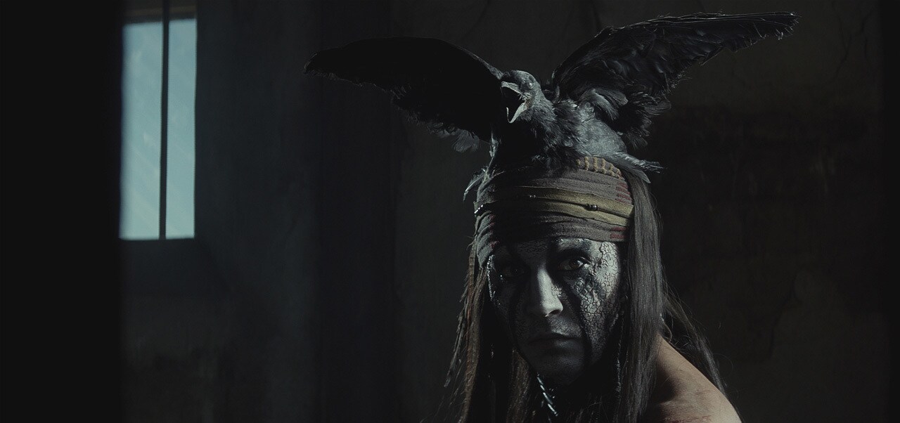 Image of Tonto with a crow on his head from the movie "The Lone Ranger"