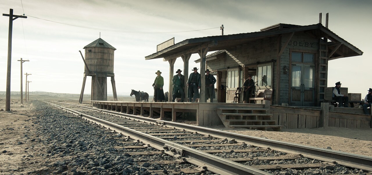 Group of people waiting on a train from the movie "The Lone Ranger"