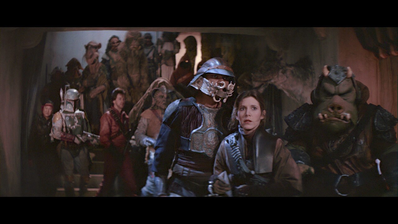 Expecting the escape attempt, Jabba's henchmen -- including Lando Calrissian in disguise -- surro...