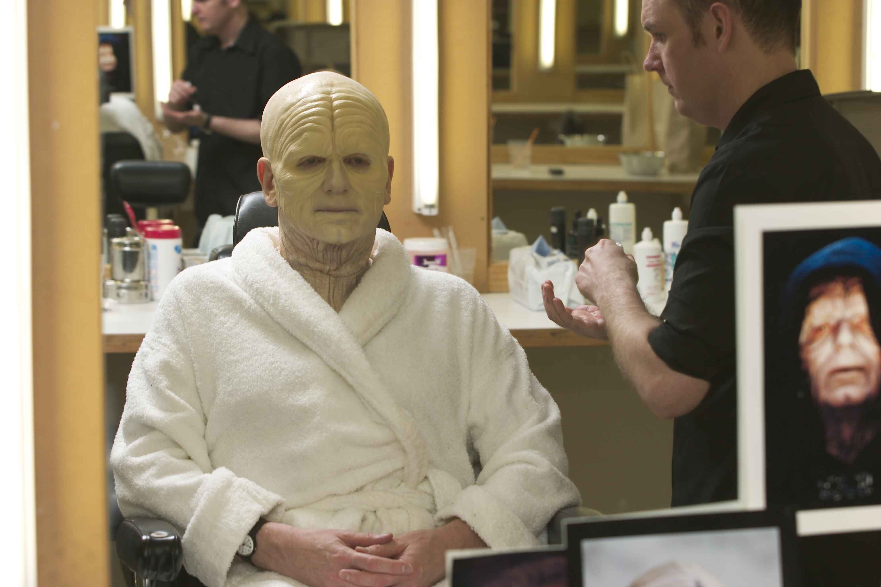 Ian McDiarmid (as Palpatine, after his disfigurement) sits for makeup.