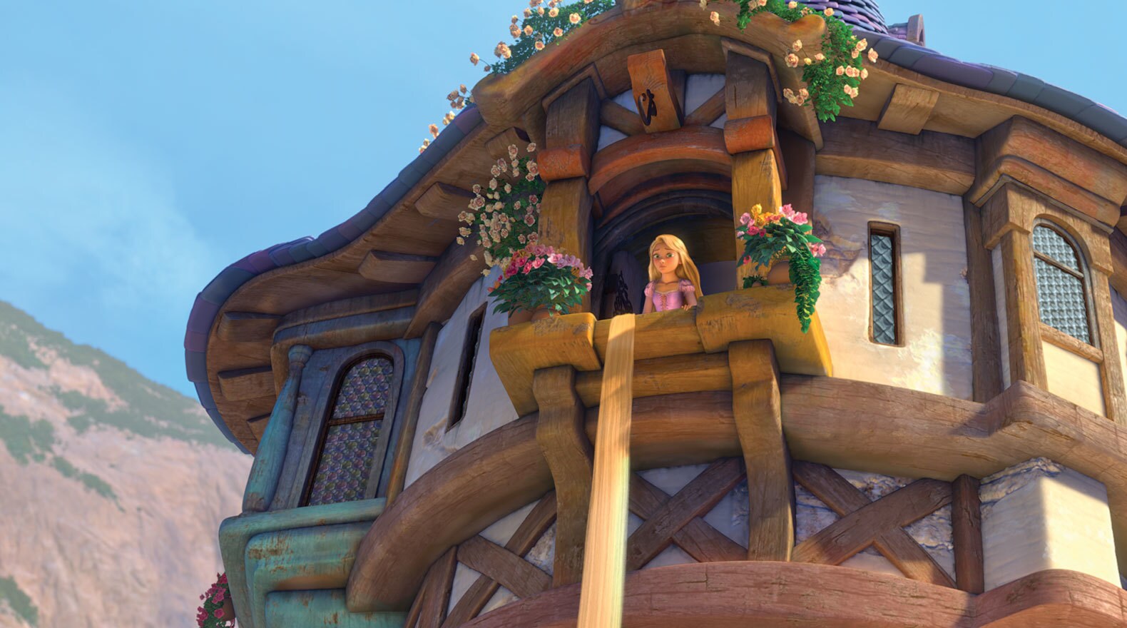 Rapunzel voiced by Mandy Moore hangs her hair out of her window