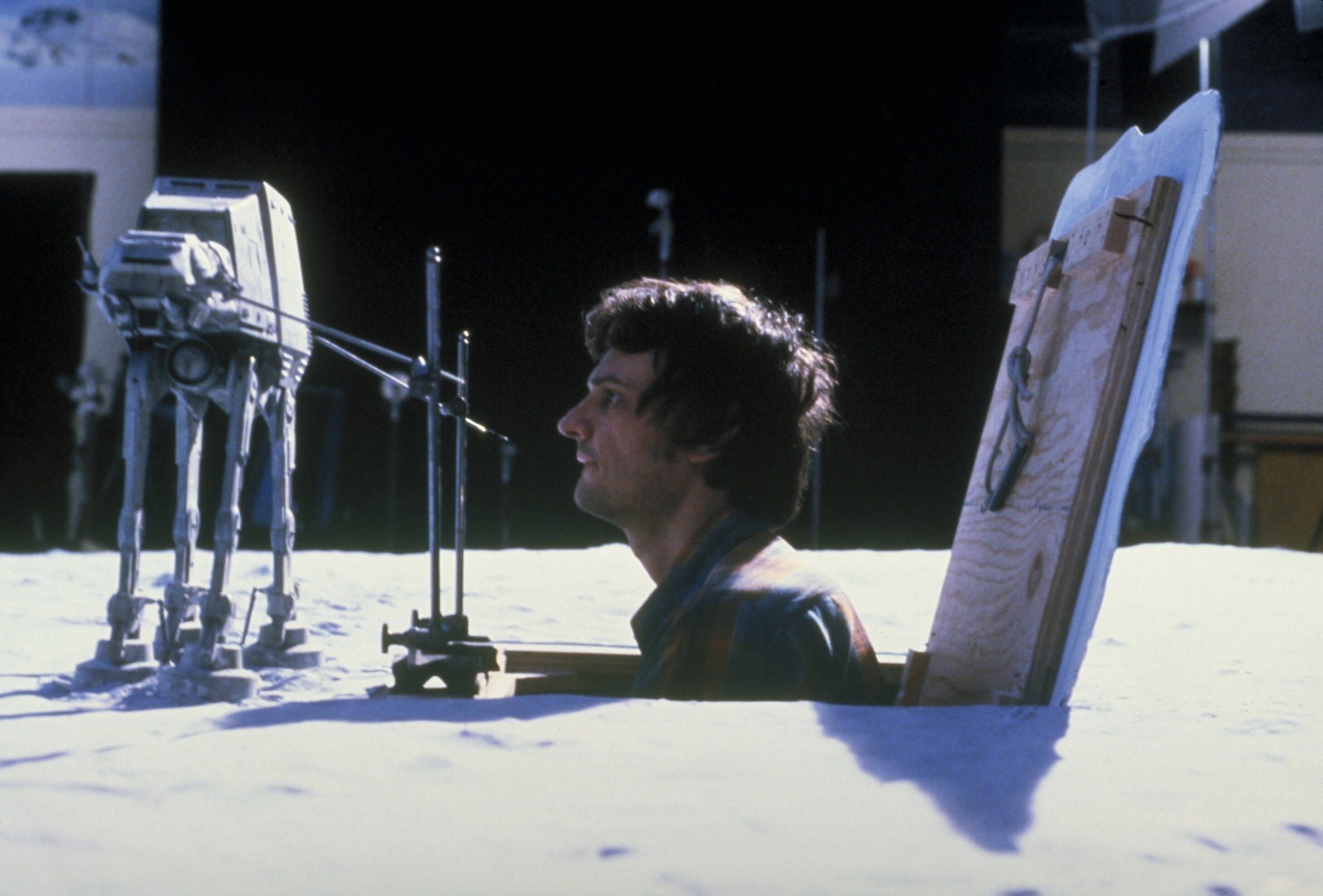 ILM animator Jon Berg moves an AT-AT model frame by frame for a stop-motion effect.