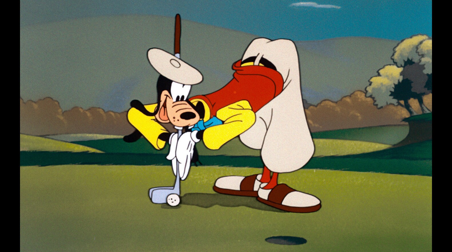 Goofy gives everyone a lesson on the fairway.