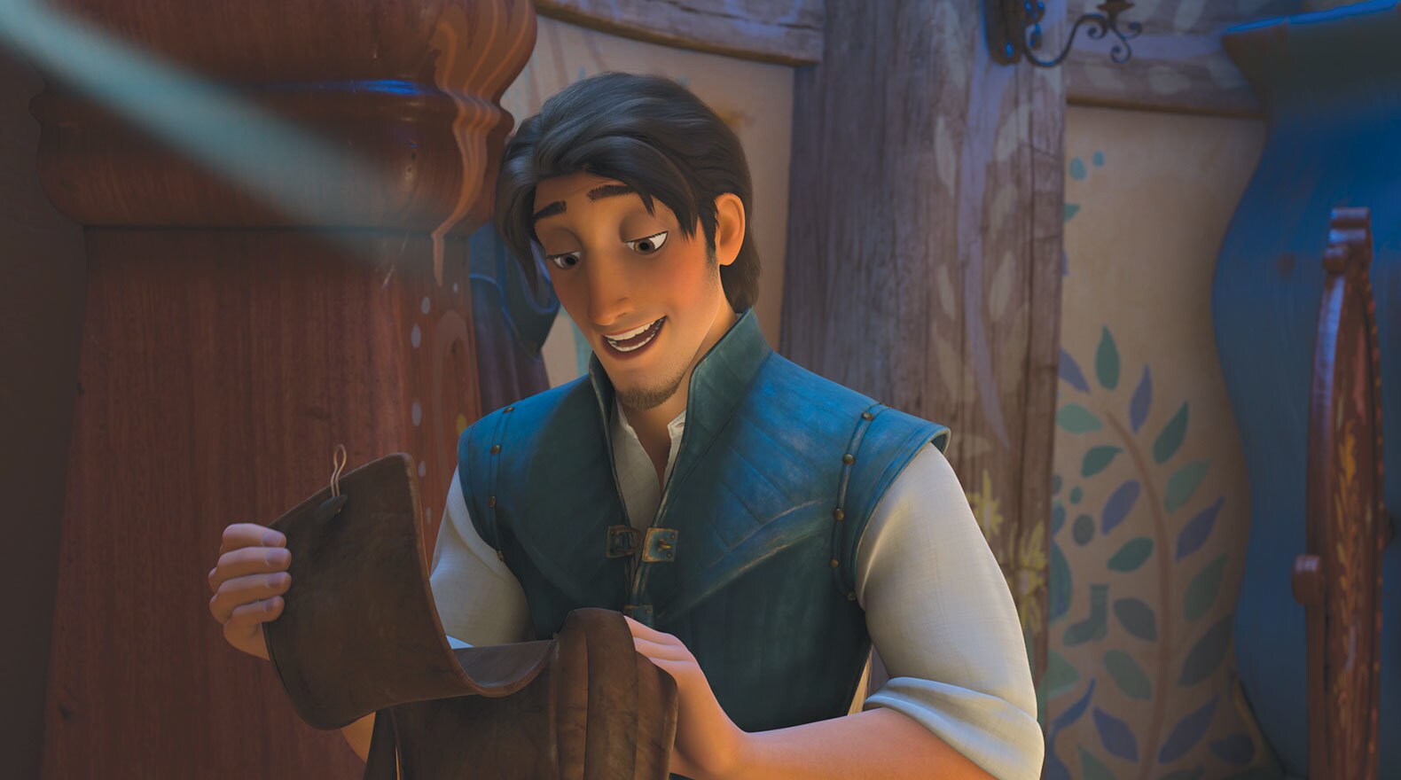 Flynn Rider holding a satchel in the movie Tangled
