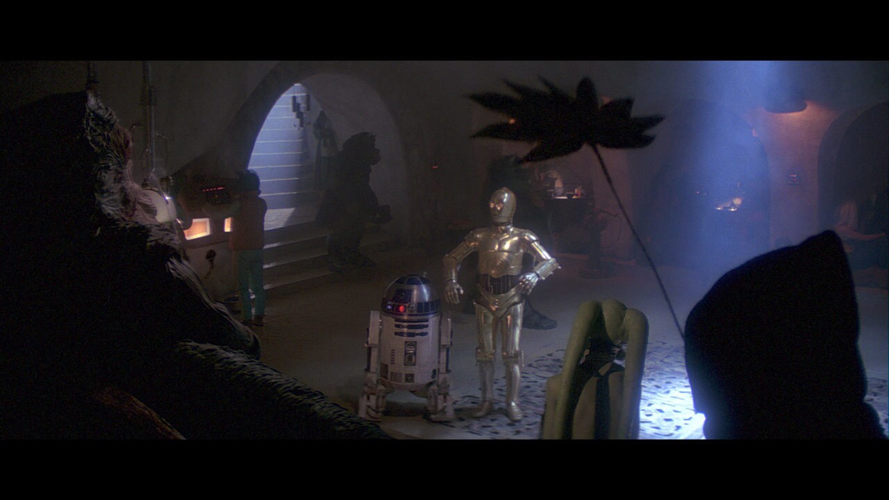 R2-D2 and C-3PO request an audience with Jabba, pleading on behalf of Luke Skywalker for Han Solo...