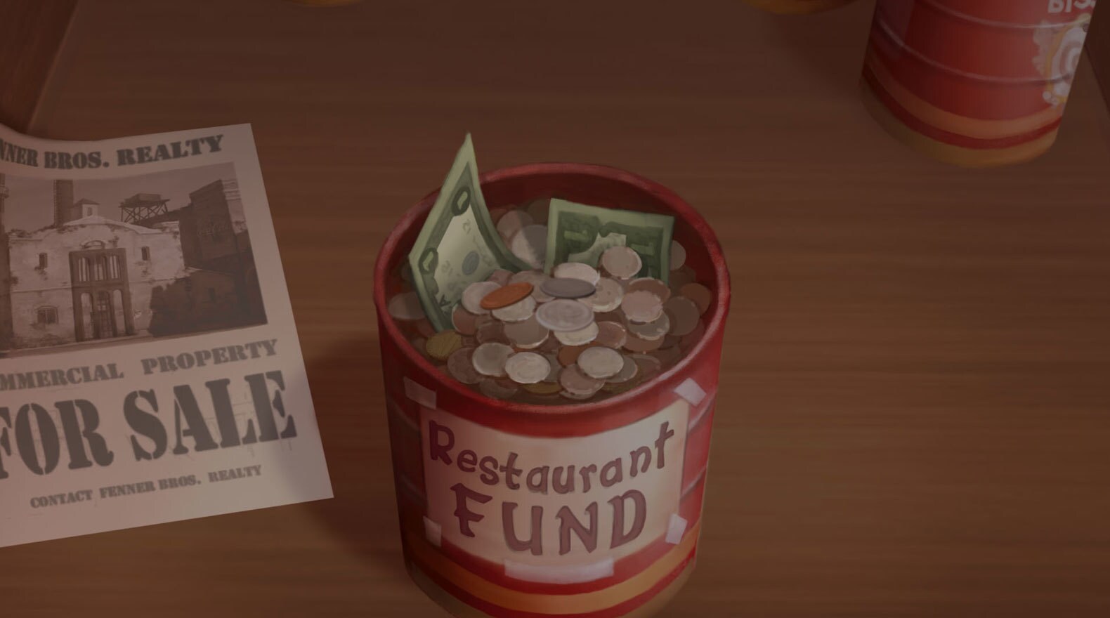 Can of money labeled "Restaurant Fund"