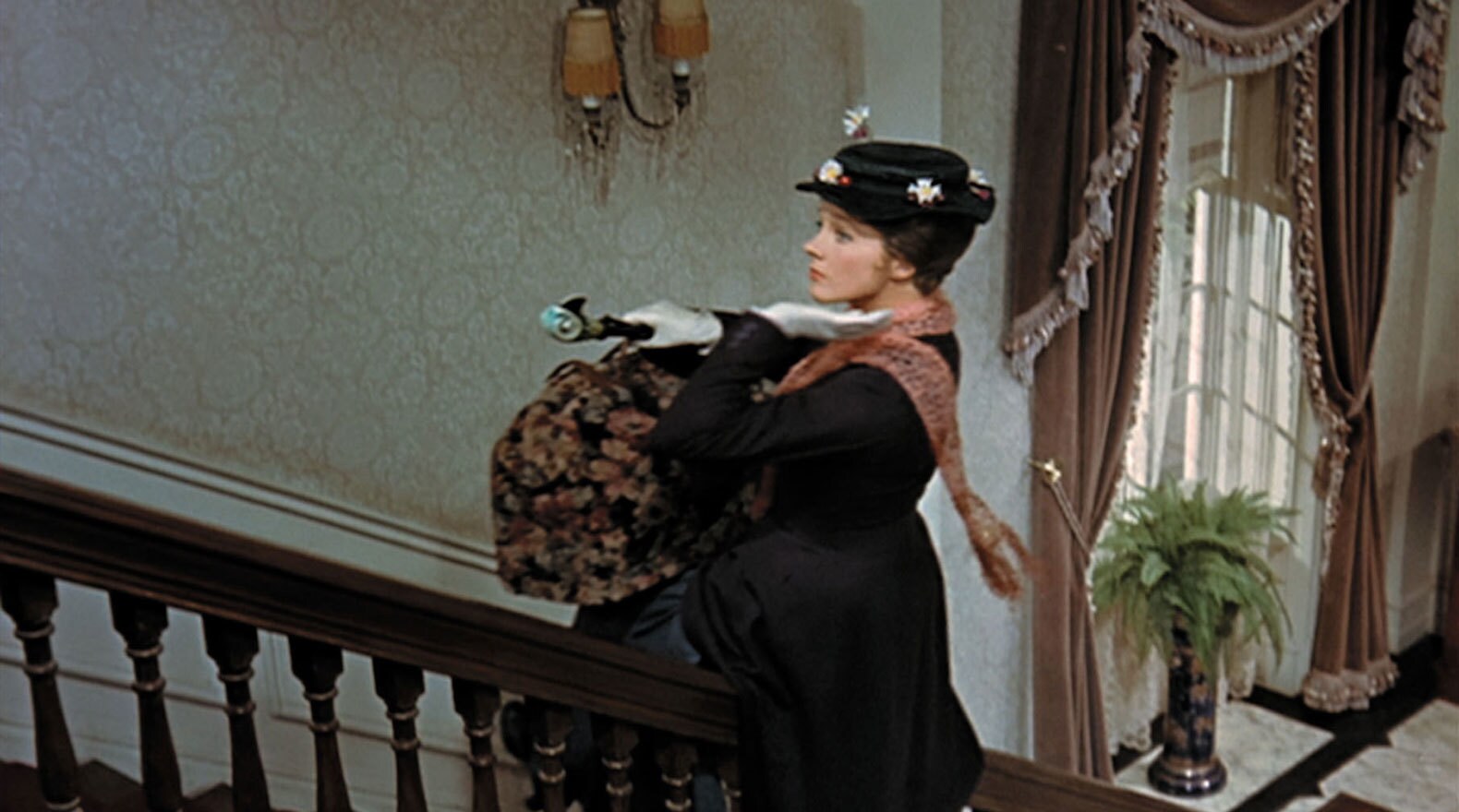 Mary Poppins gliding up the banister in "Mary Poppins"