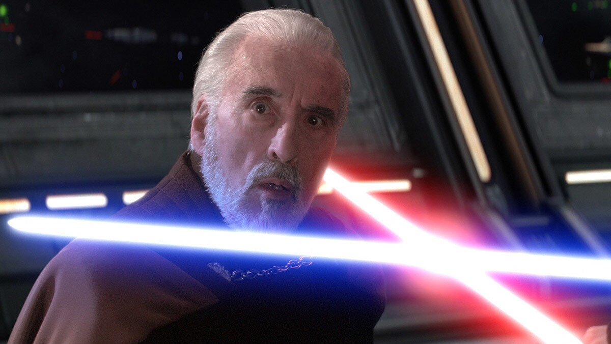 Count Dooku kneeling at the mercy of Anakin Skywalker