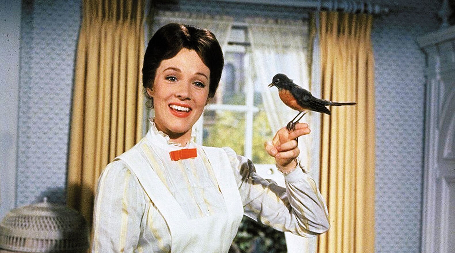 Mary Poppins sings "A Spoonful of Sugar" with a bird on her finger in "Mary Poppins"