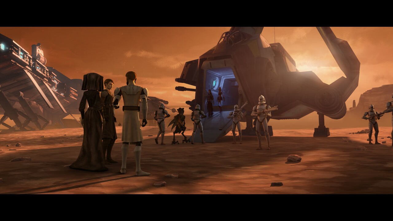 At a landing area on Geonosis, clone troopers march a manacled Poggle the Lesser aboard a waiting...