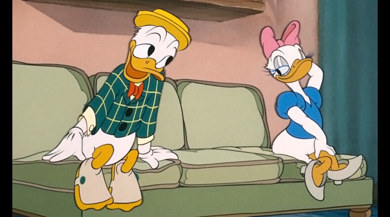 Donald tries to get Daisy’s attention.