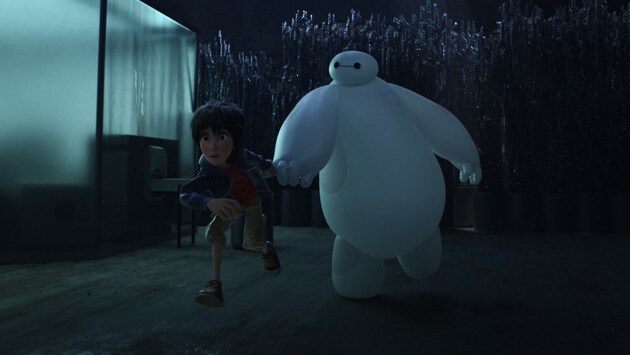 Baymax (voiced by Scott Adsit) and Hiro (voiced by Ryan Potter) in the movie "Big Hero 6"