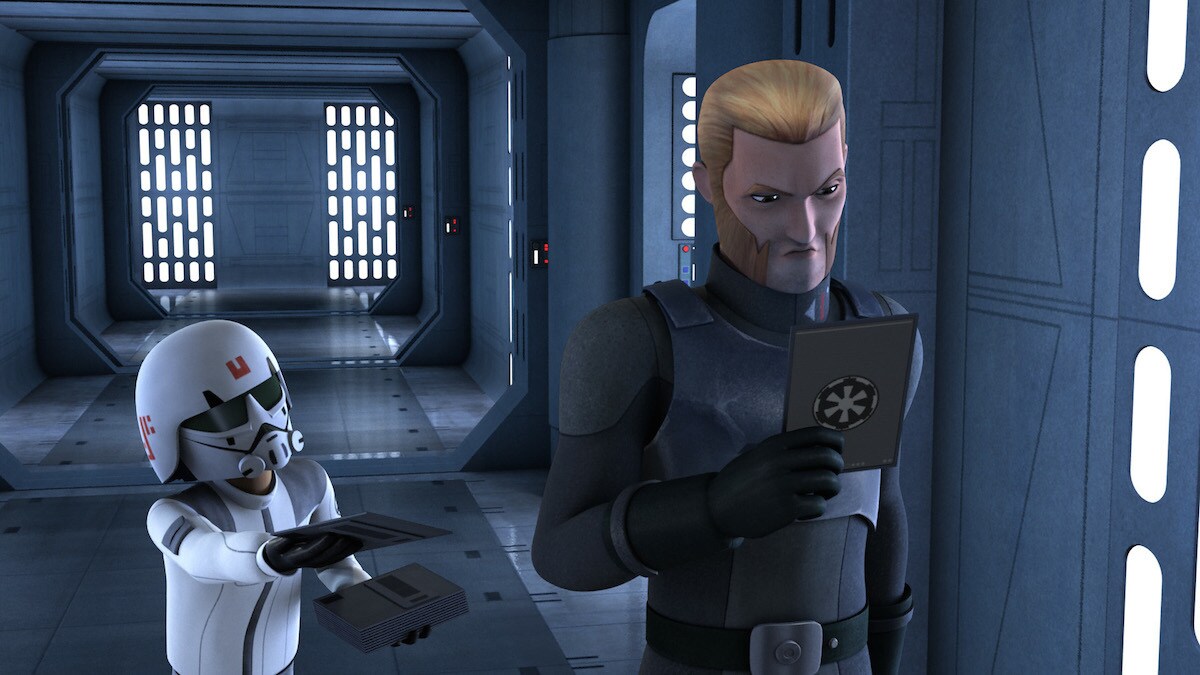 Agent Kallus inspecting a datapad from a disguised Ezra Bridger