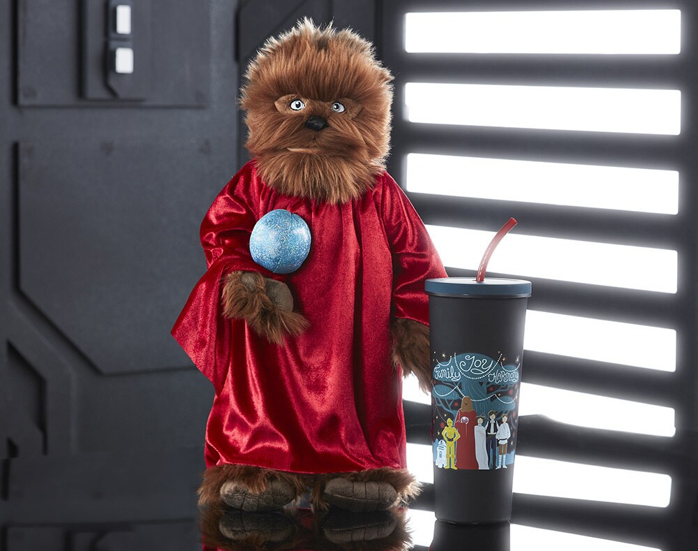 A chewbacca plush in Life Day robes and a tumbler
