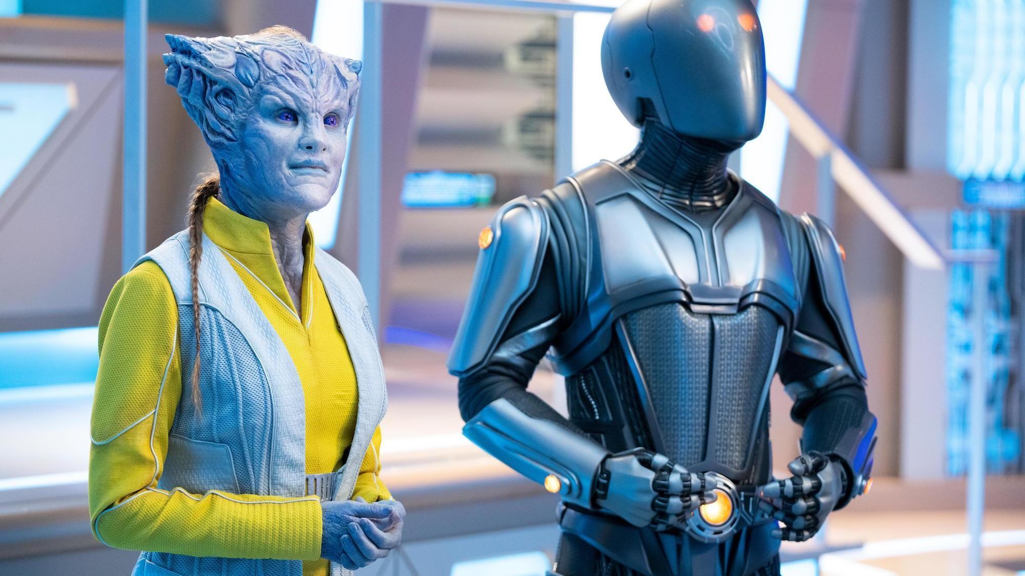 The Orville: New Horizons -- “From Unknown Graves” - Episode 307 -- The Orville discovers a Kaylon with a very special ability. Dr. Villka (Eliza Taylor) and Isaac (Mark Jackson), shown. (Photo by: Greg Gayne/Hulu)