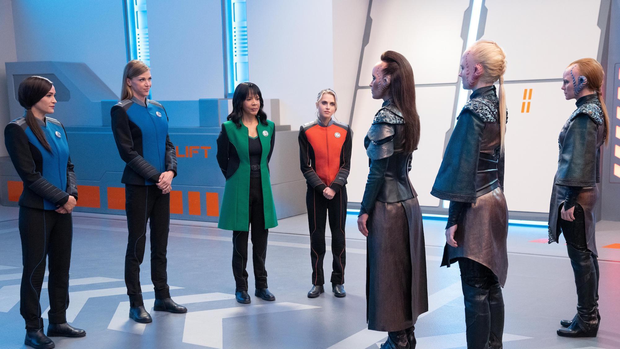 The Orville: New Horizons -- “From Unknown Graves” - Episode 307 -- The Orville discovers a Kaylon with a very special ability. Lt. Talla Keyali (Jessica Szohr), Cmdr. Kelly Grayson (Adrianne Palicki), Dr. Claire Finn (Penny Johnson Jerald), and Charly Burke (Anne Winters), shown. (Photo by: Greg Gayne/Hulu)