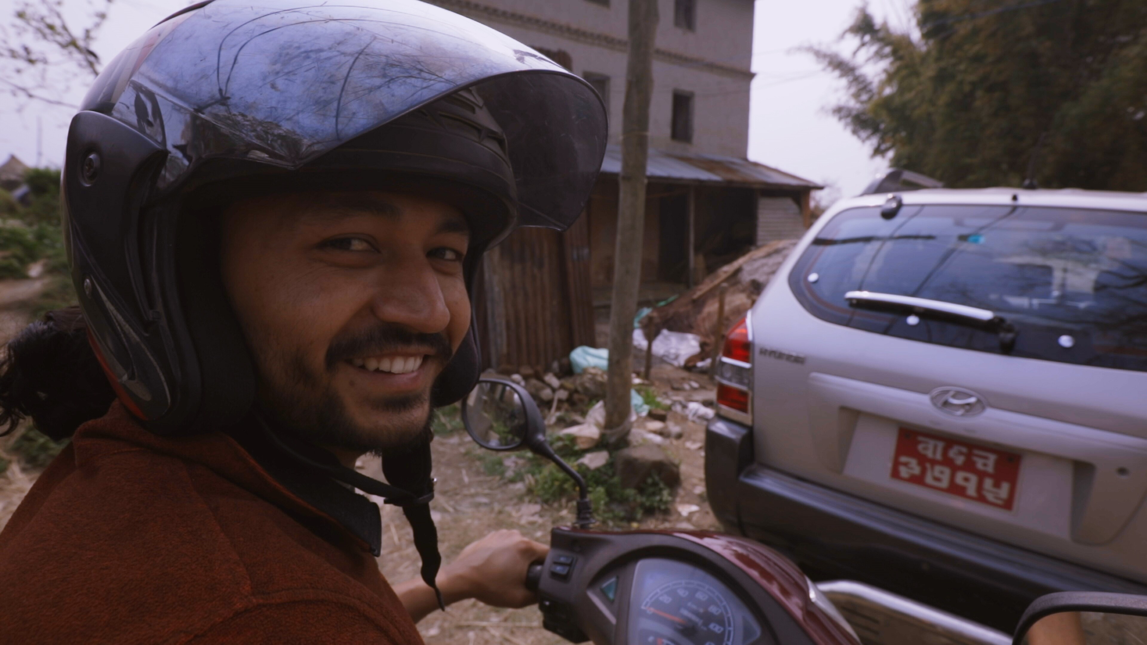 Bhaktapur, Nepal - Santosh Pandey rides a motorcycle through his hometown of Bhaktapur, Nepa. (Credit: Future of Work Film Inc)