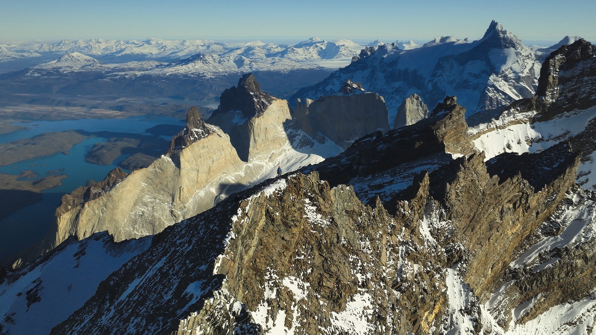 Aerial shot of Bertie Gregory at the mountain peak. (National Geographic for Disney+/Bertie Gregory)