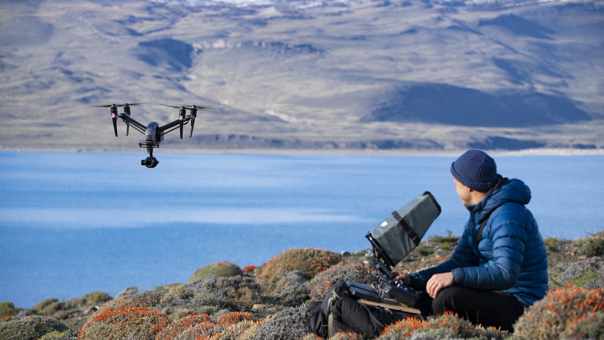 Bertie Gregory controlling the drone in Patagonia. (National Geographic for Disney+/Anna Dimitriadis)