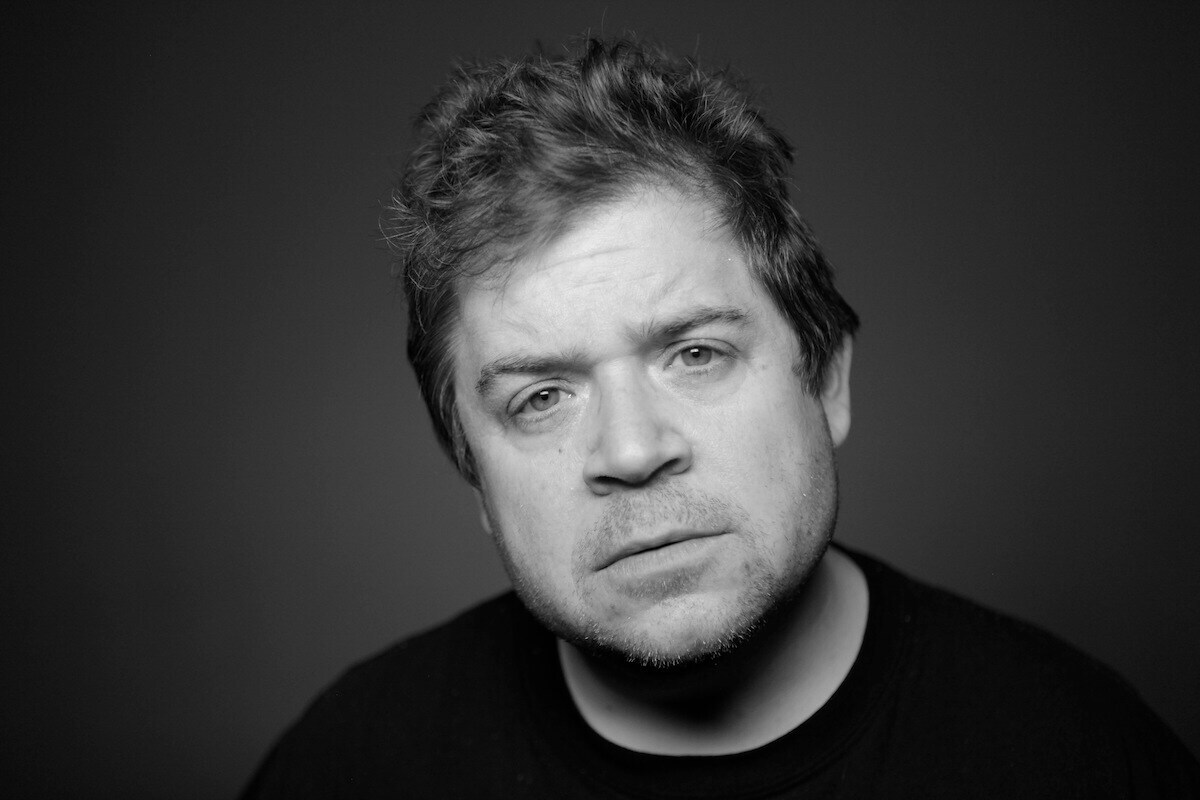 Patton Oswalt wearing a black tee