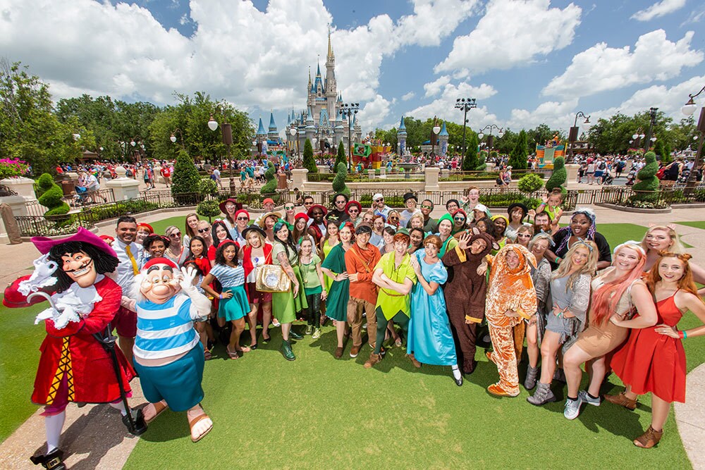 Fans posing for a picture during Peter Pan's 65th Anniversary Parade