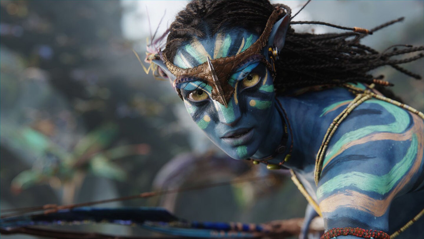 Neytiri played by Zoe Saldana flies into battle