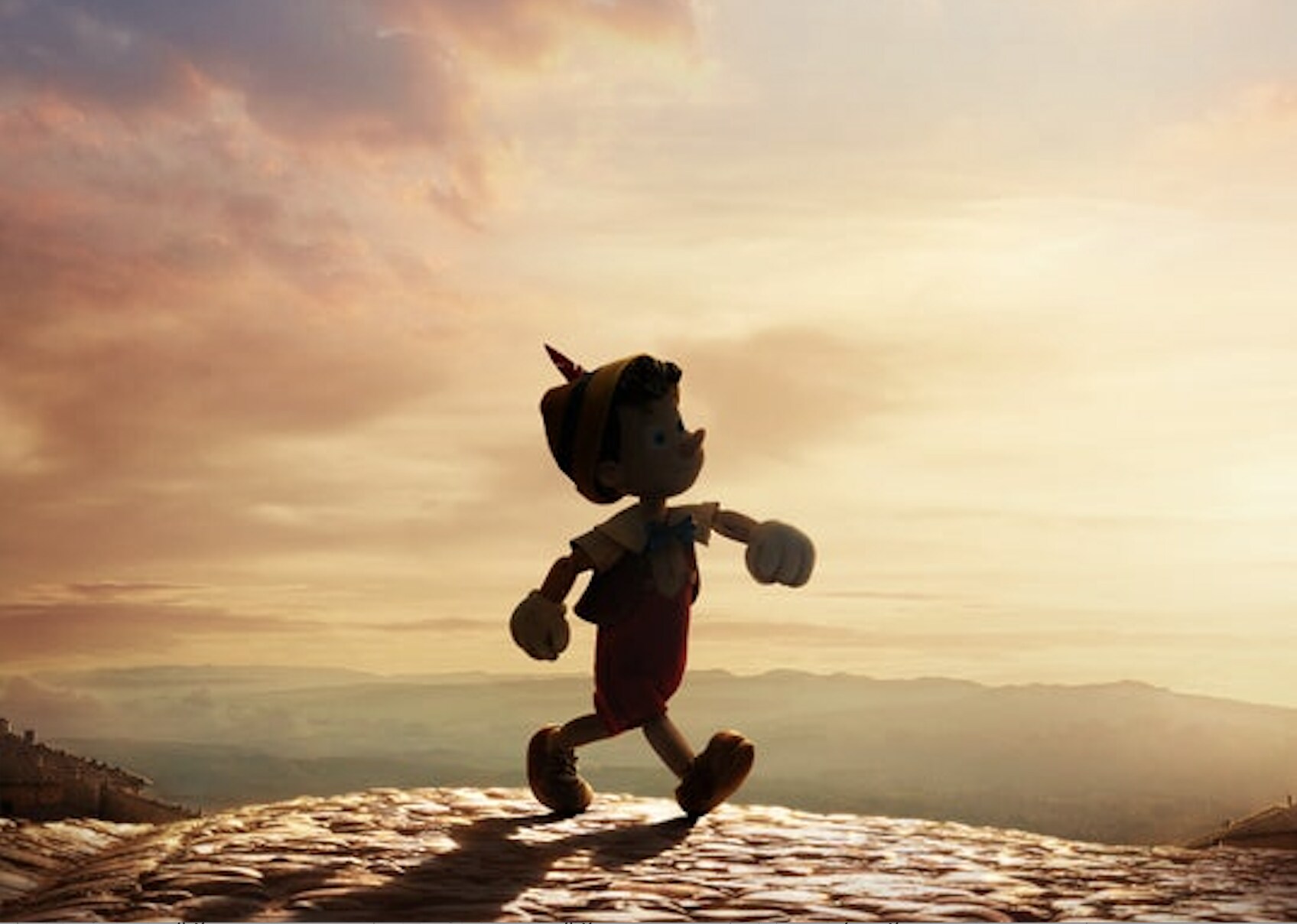 Pinocchio walks into the sunset in the new live-action movie, Pinocchio