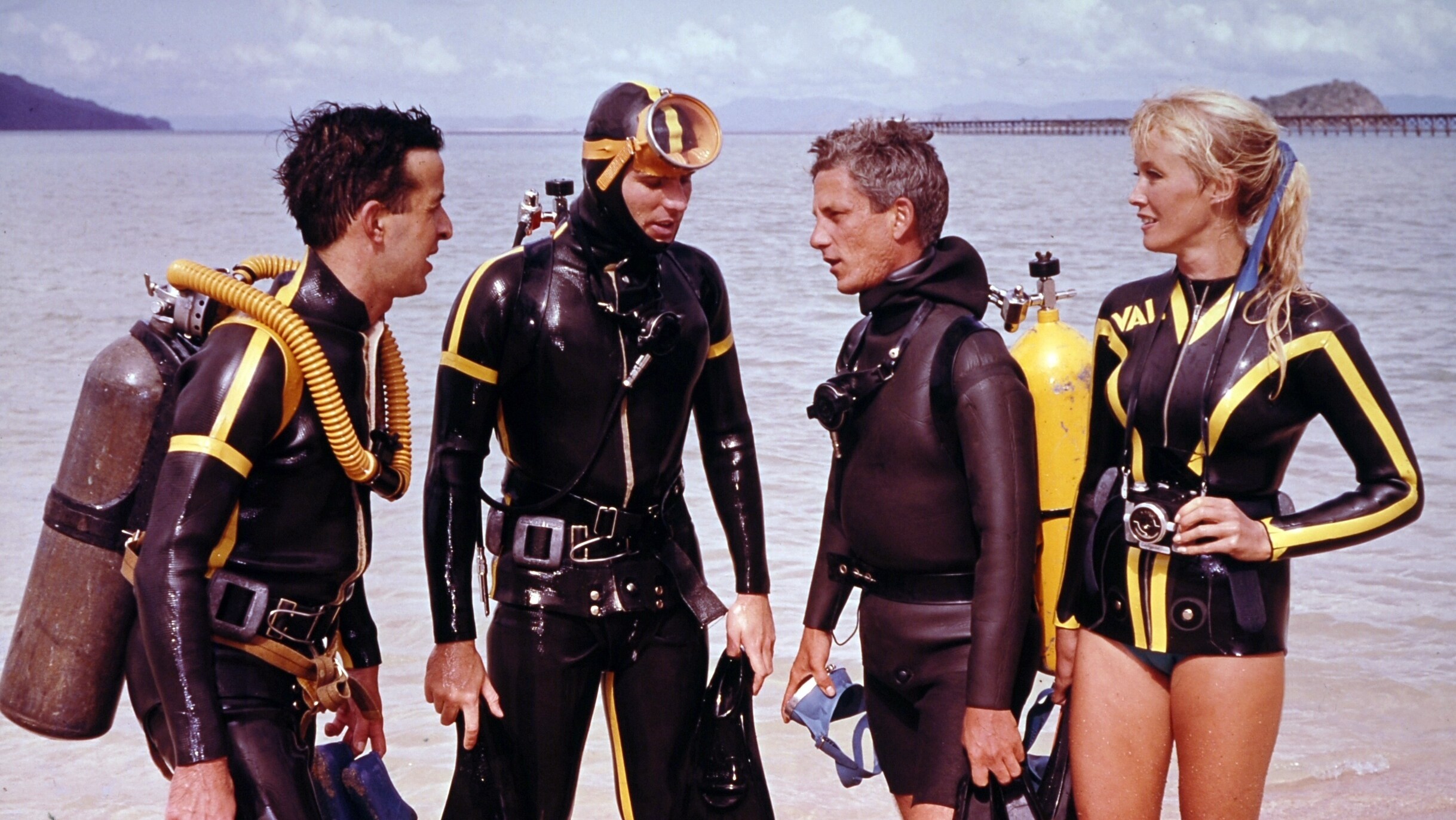 Valerie Taylor with friends in scuba equipment on the beach in 1968.  (photo credit: Ron & Valerie Taylor)