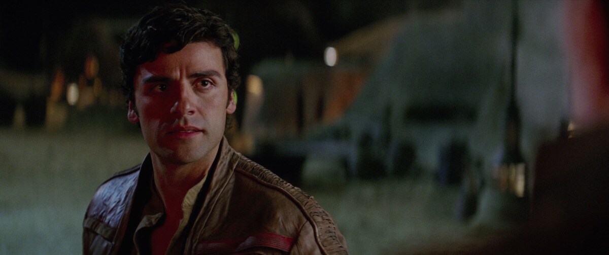 Poe Dameron talking with Lor San Tekka on Jakku