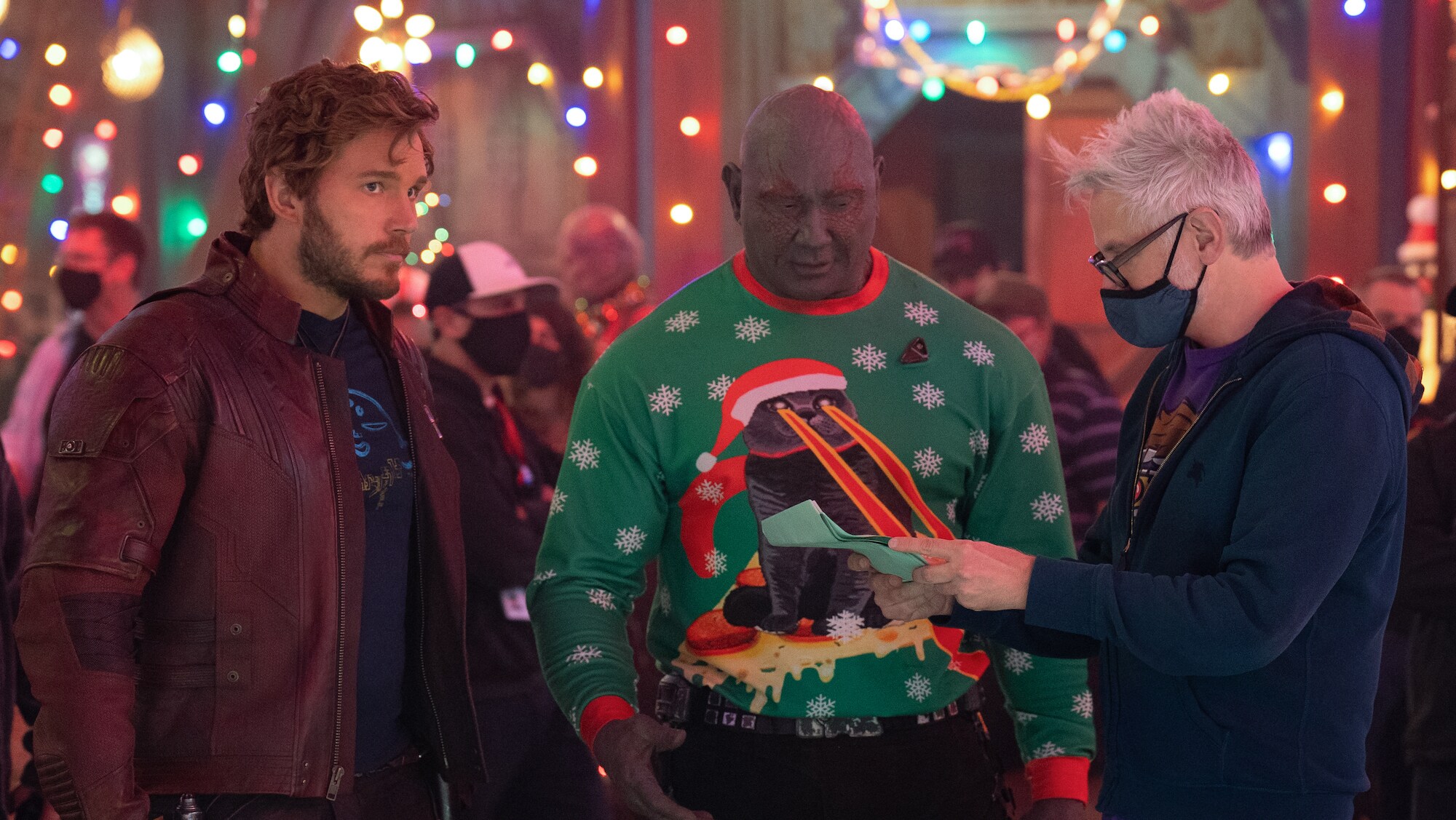 (L-R): Chris Pratt as Peter Quill/Star-Lord, Dave Bautista as Drax, and Director/Writer James Gunn behind the scenes of Marvel Studios' THE GUARDIANS OF THE GALAXY: HOLIDAY SPECIAL. Photo by Jessica Miglio. © 2022 MARVEL.