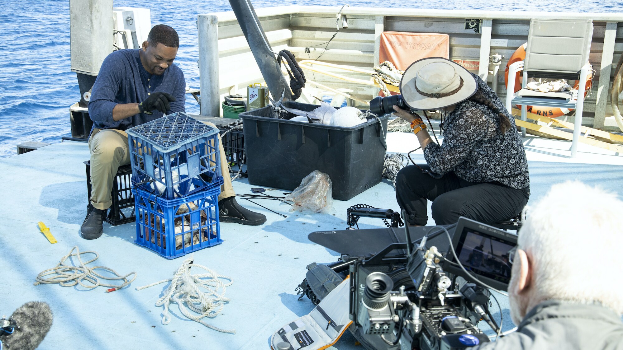 Will Smith on a boat with Photographer Cristina Mittermeier as they investigate the power of smell.  (National Geographic for Disney+/Kyle Christy)
