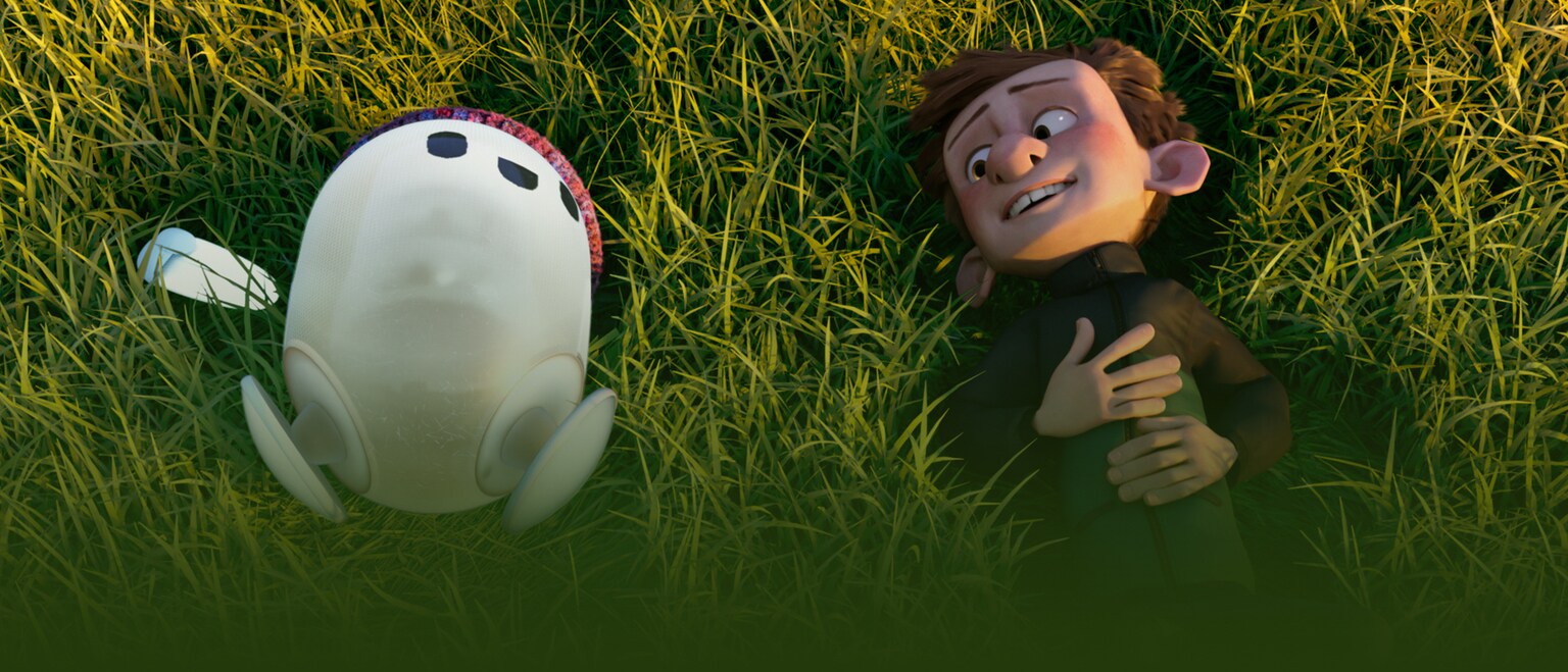 Image of Ron and Barney lying on the grass from the 20th Century Studios movie Ron's Gone Wrong.