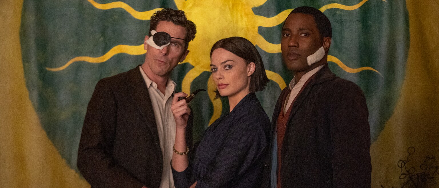 Image of actors Christian Bale, Margot Robbie, and John David Washington from the 20th Century Studios movie "Amsterdam".