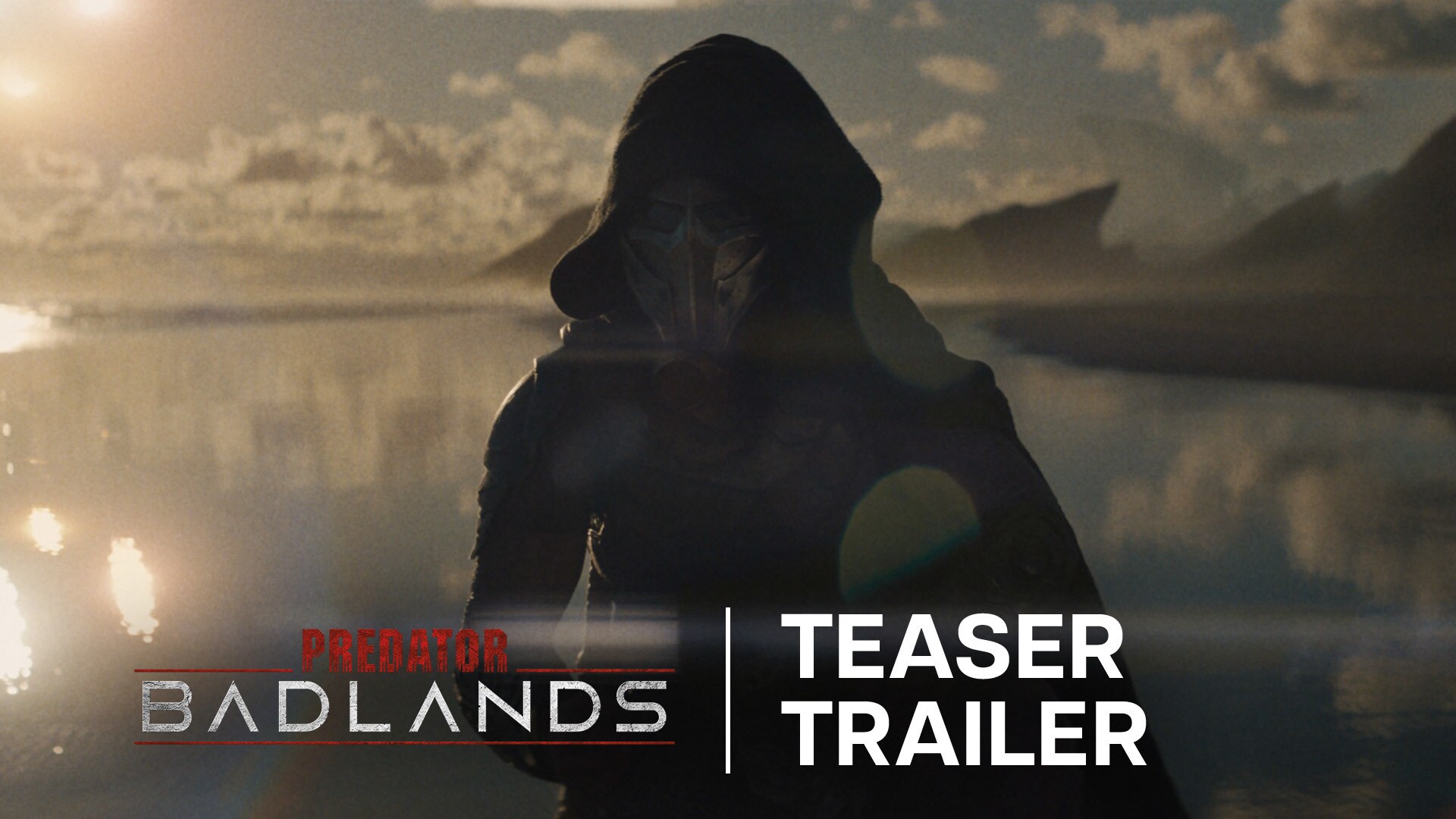 Image of a cloaked figure in front of a body of water | Predator: Badlands | Teaser Trailer