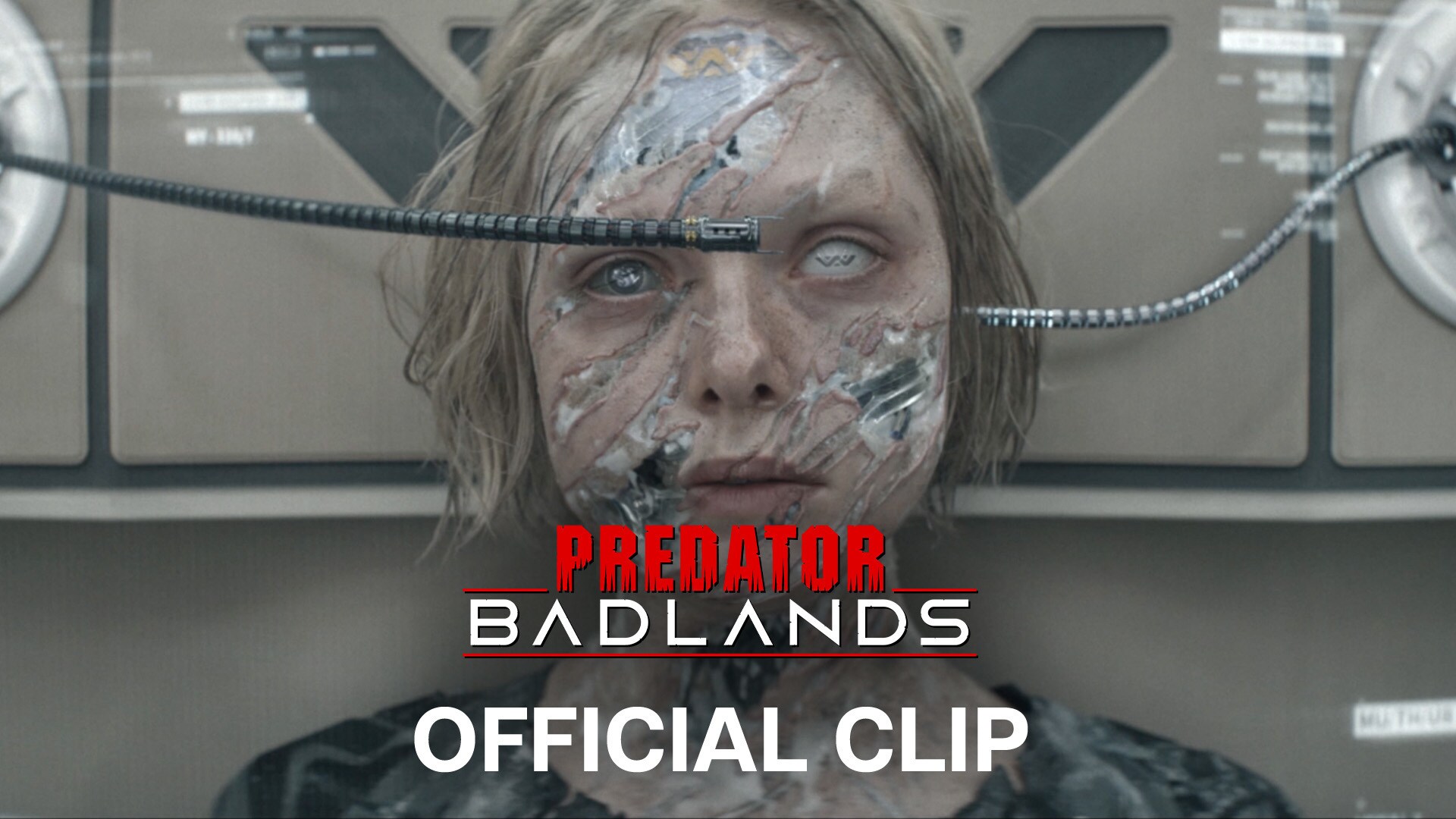 Image of the cyborg, Tessa, with several wires protruding from its head. | Predator: Badlands | Official clip
