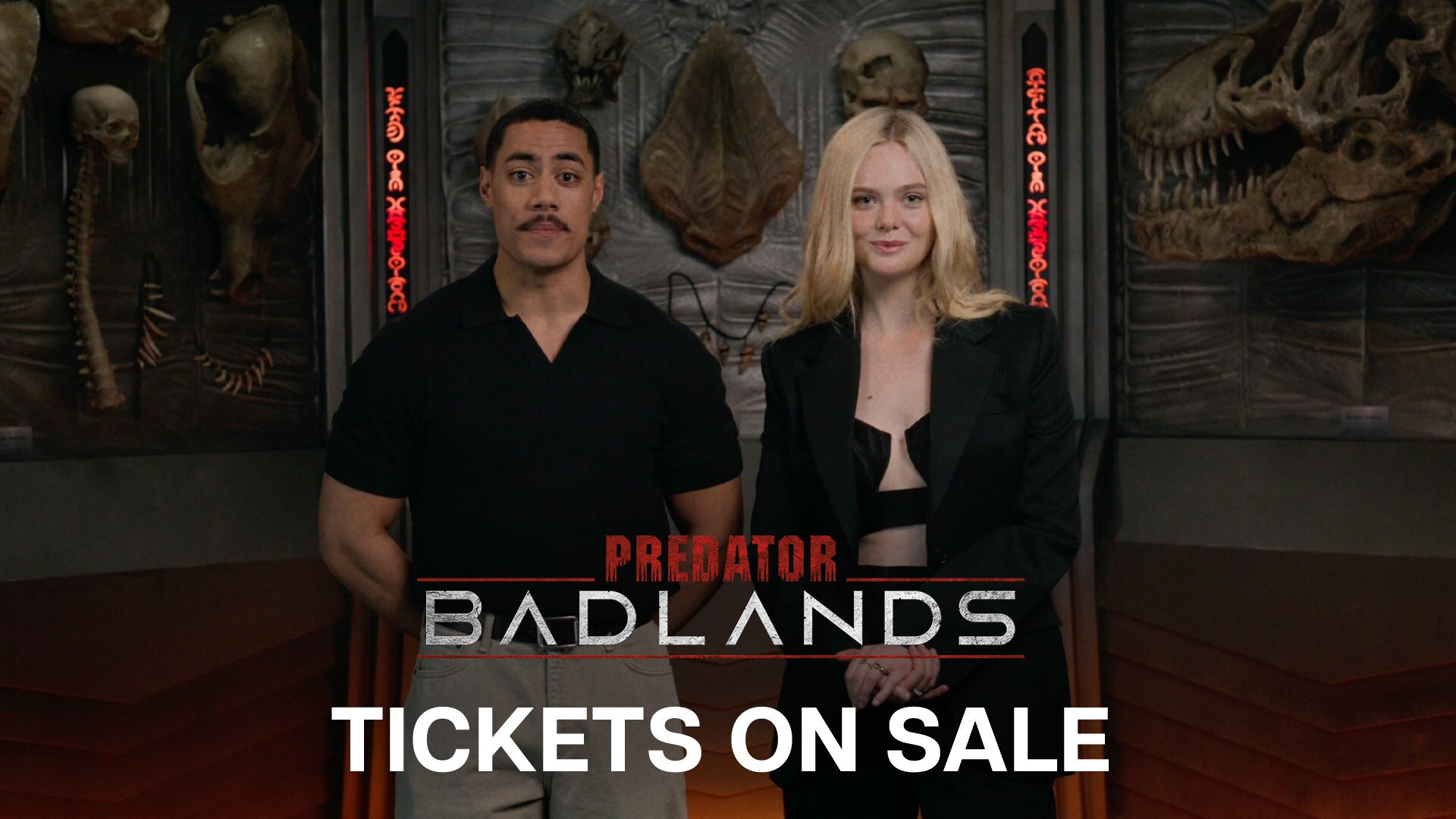 Image of actors Dimitrius Schuster-Koloamatangi (Dek) and Elle Fanning (Thia) | Predator: Badlands | Tickets on sale