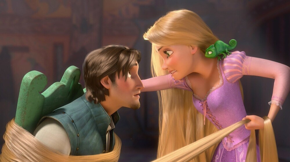 Flynn Rider tied up by Rapunzel's hair. Rapunzel with Pascal on her shoulder.