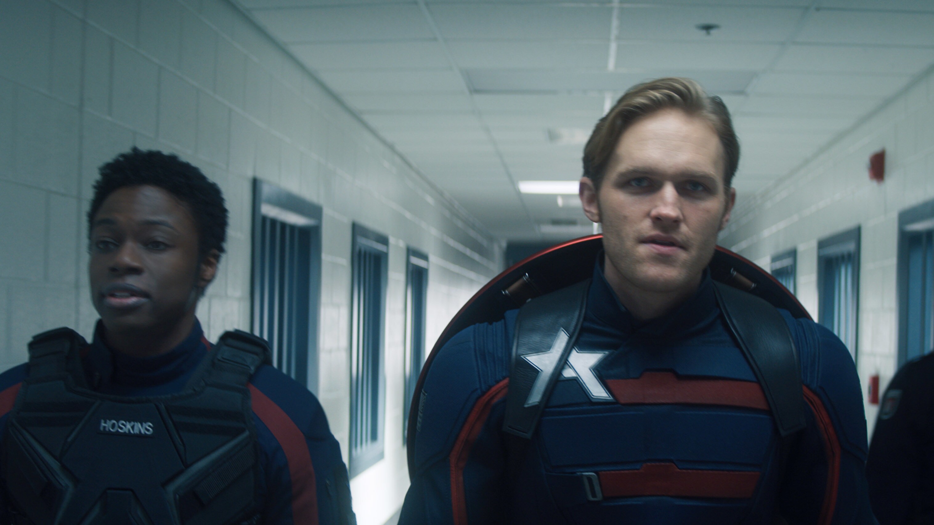 (L-R): Lemar Hoskins (Clé Bennett) and John Walker (Wyatt Russell) in Marvel Studios' THE FALCON AND THE WINTER SOLDIER exclusively on Disney+. Photo courtesy of Marvel Studios. ©Marvel Studios 2021. All Rights Reserved.