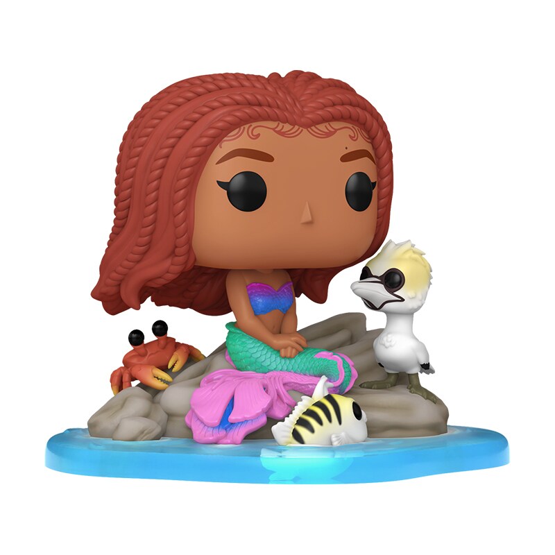 Image of the live action The Little Mermaid Ariel Funko figure sitting on a rock, with Sebastian, Scuttle, and Flounder.