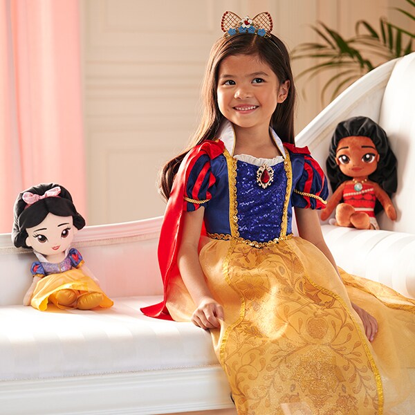 Image of a girl wearing a Snow White costume from the Disney Princess Costume Collection.