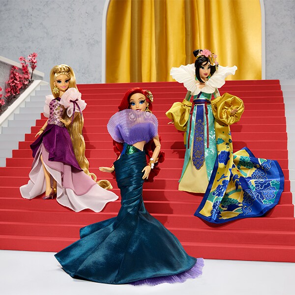 Image of the Rapunzel, Ariel, and Mulan dolls from the Enchanted Elegance Collection.