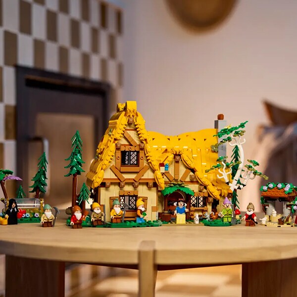 Image of the LEGO Snow White and the Seven Dwarfs' Cottage set, set up on a table.