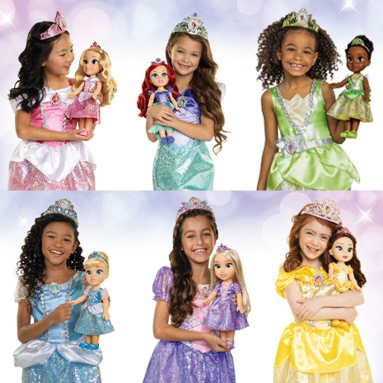 Image of girls wearing different Disney Princess dresses and holding matching My Friend Dolls.