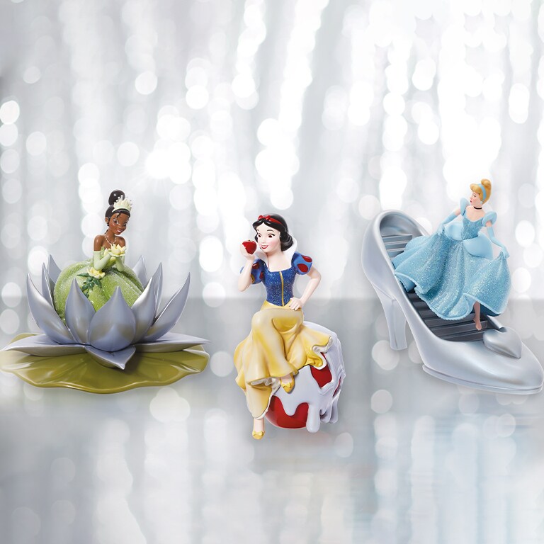 Photo of Enesco Disney100 Princess Figurines (L-R) Tiana, Snow White, and Cinderella.
