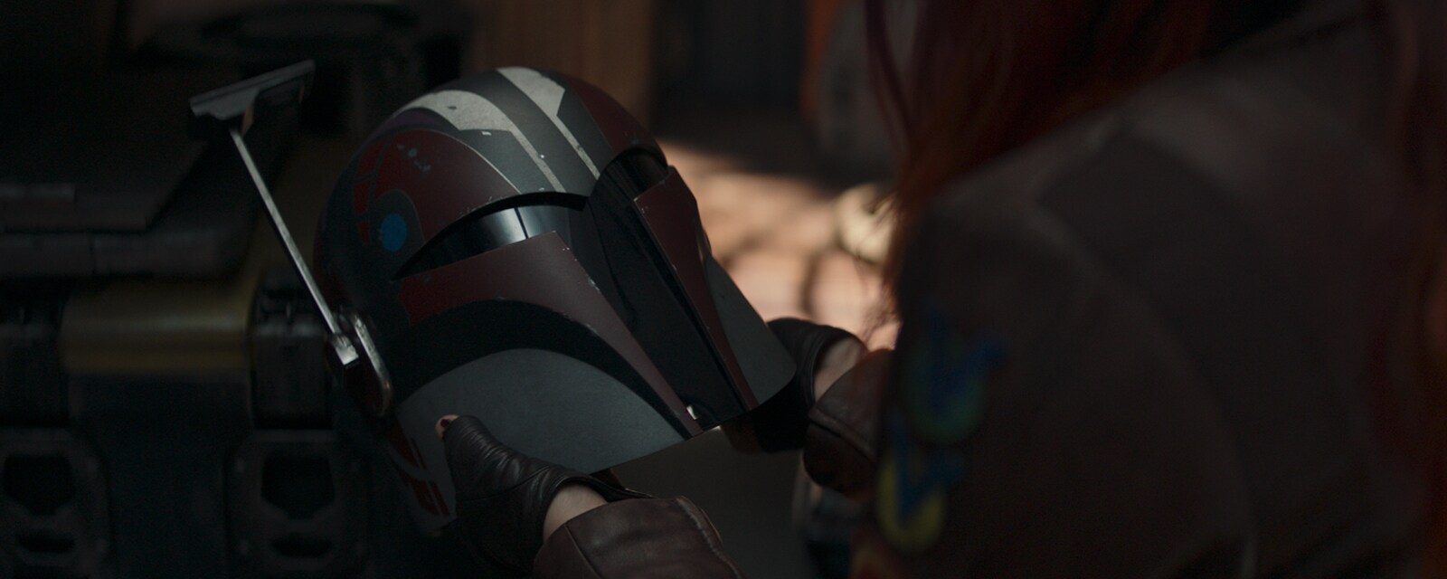 Sabine looking at her helmet