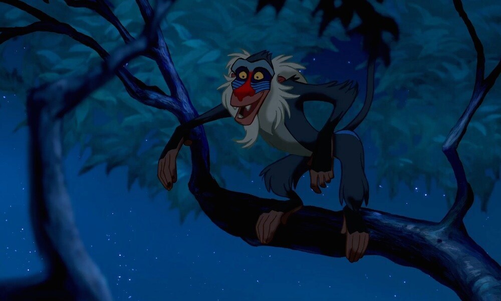 Animated characters Rafiki (baboon) in a tree from the movie "The Lion King"