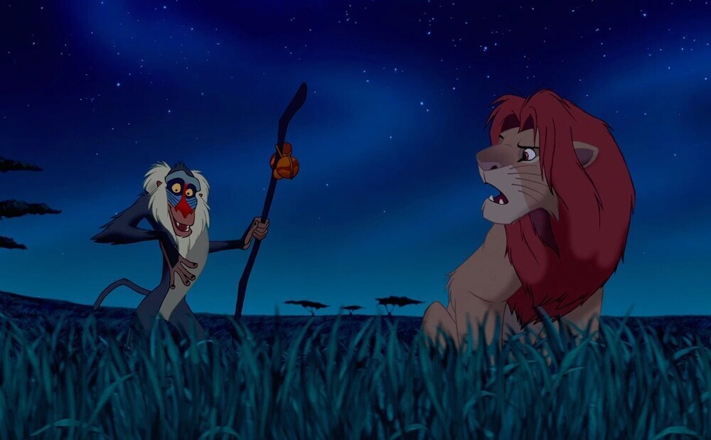 Animated characters Rafiki (baboon) and Simba (lion) from the movie "The Lion King"